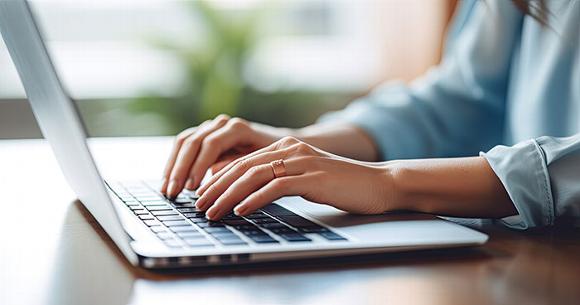 lady typing on laptop