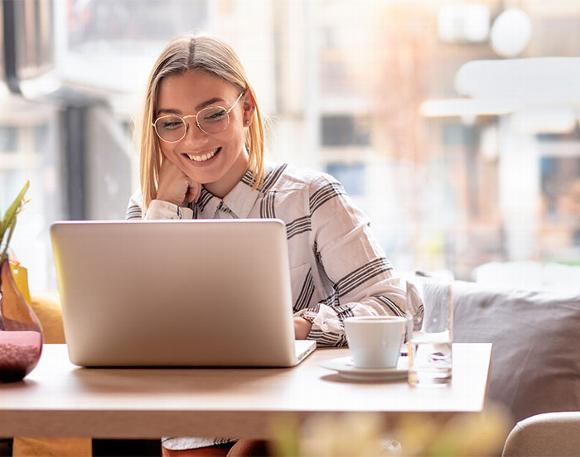 Lady working on laptop in cafe